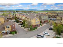 Beautiful aerial view of townhomes showcasing the community's layout and mountain views at 12820 King St, Broomfield, CO 80020