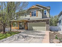 Charming two-story home with stone accents, attached garage, and welcoming front porch at 4337 San Marco Dr, Longmont, CO 80503