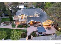Stunning aerial view of a home showcasing manicured landscaping and a relaxing outdoor living space at 709 Baseline Rd, Boulder, CO 80302