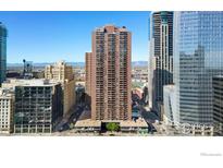 High-rise condo building exterior with balconies and city view under a clear blue sky at 1020 15Th St # 15E, Denver, CO 80202