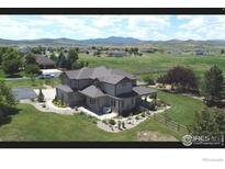 Beautiful two-story home with mature landscaping and mountain views at 1105 Shelby Dr, Berthoud, CO 80513