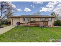 Charming one-story home featuring a ramp and well-maintained lawn at 13580 Eliot Ct, Broomfield, CO 80020