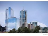An alluring Denver city skyline with modern buildings on a bright sunny day at 891 14Th St # 3815, Denver, CO 80202