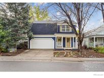 Charming two-story home with a well-maintained front yard and attached two-car garage at 1032 Pegasus Pl, Lafayette, CO 80026