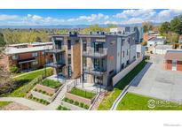 Modern townhome showcasing clean lines, stone accents, and private balconies with mountain views at 1385 N King St, Denver, CO 80204