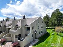 Attractive condo featuring a patio and well-maintained lawn area at 6899 Countryside Ln # 269, Niwot, CO 80503