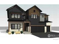 New construction home showcasing contemporary design with stone accents and a dark color palette at 933 Saint Andrews Ln, Louisville, CO 80027