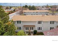Charming townhome features well-maintained landscaping and a welcoming entrance at 1915 S Oakland Way, Aurora, CO 80014