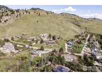 Breathtaking aerial view of a secluded home nestled in the Colorado foothills at 230 Cactus Ct, Boulder, CO 80304