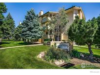 Stratford Arms with a lush green lawn and mature trees, perfect for enjoying the outdoors at 3035 Oneal Pkwy # T, Boulder, CO 80301