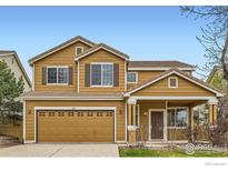 Inviting two-story home featuring a classic design, well-maintained landscaping, and a two-car garage at 3617 Blanca Peak Dr, Superior, CO 80027