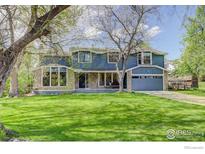 Charming two-story home with stone accents and a well-maintained lawn at 4251 Peach Way, Boulder, CO 80301