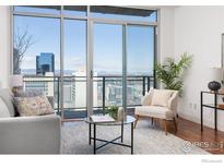 Bright living room with floor-to-ceiling windows and stunning city views at 2001 Lincoln St # 2113, Denver, CO 80202