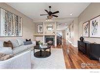 Inviting living room boasts a fireplace, modern decor, and hardwood floors at 3734 Ridgeway St, Boulder, CO 80301