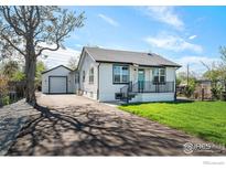 Charming home with a well-maintained lawn, fresh paint, and inviting curb appeal at 5383 Meade St, Denver, CO 80221