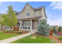 Inviting two-story home with a charming front porch and well-maintained lawn at 8919 Yates Dr, Westminster, CO 80031