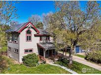 Charming two-story home with a covered front porch and solar panels on the roof at 265 31St St, Boulder, CO 80305