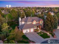 Beautiful two-story home with a three-car garage, brick accents, and a well-manicured front yard at 9980 Newton Ct, Westminster, CO 80031