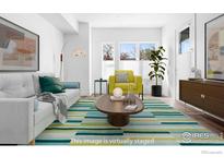 Bright living room with stylish furnishings and large windows offering ample natural light at 1707 Walnut St # 106, Boulder, CO 80302