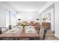 Stylized dining area featuring a wooden table with seating for four and neutral decor at 1707 Walnut St # 207, Boulder, CO 80302