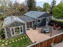 An aerial view of a backyard featuring a patio area with outdoor furniture at 301 29Th St, Boulder, CO 80305