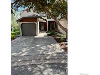 Charming home featuring a well-maintained front yard, covered entry and attached garage for convenience at 4619 Chestnut Ln, Boulder, CO 80301