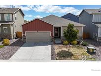 Charming single-Gathering home featuring a two-car garage and low-maintenance landscaping at 14868 Guernsey Dr, Mead, CO 80542