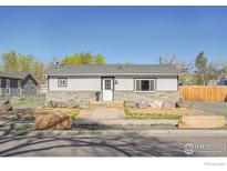 Charming single-story home featuring stone accents and a well-maintained front yard at 365 Briggs St, Erie, CO 80516