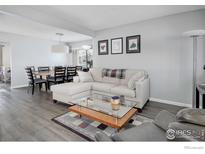 Cozy living room featuring a comfortable sectional sofa and a modern glass-top coffee table at 750 W Moorhead Cir # A, Boulder, CO 80305