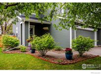 Charming home with a well-maintained front yard featuring colorful landscaping at 11040 York St, Northglenn, CO 80233