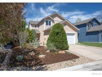 Inviting two-story home with a manicured front yard and attached two car garage at 3821 Howe Ct, Boulder, CO 80301
