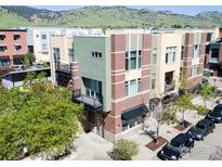Attractive condo building with brick accents, balconies, and mountain views at 4585 13Th St # 1-C, Boulder, CO 80304