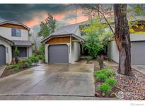 Charming townhome with landscaped front yard, driveway, and attached garage in a quiet neighborhood at 4647 Dapple Ln # 1, Boulder, CO 80301