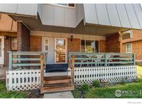 Inviting front porch with painted railings and space for outdoor seating near a brick house at 11656 Logan St, Northglenn, CO 80233