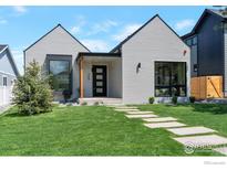 Charming home with modern architectural details, well-manicured lawn, and inviting entrance at 306 S 3Rd Ave, Superior, CO 80027