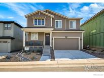 Charming two-story home with a well-manicured front yard and attached two-car garage at 390 Blackfoot St, Superior, CO 80027