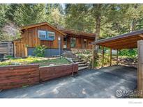 Charming wood home with covered parking nestled in a wooded landscape at 41 Silver Spruce, Boulder, CO 80302
