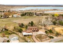 Expansive property with lake views, featuring two homes and a multi-car garage at 4963 Kelso Rd, Boulder, CO 80301