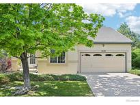 Inviting single-story home with a well-manicured lawn and mature shade tree in a desirable neighborhood at 2420 E 127Th Ave, Thornton, CO 80241