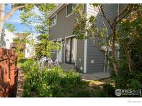 Charming home exterior featuring tidy landscaping and a well-maintained gray siding at 3740 Iris Ave # B, Boulder, CO 80301