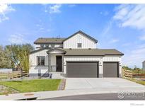 Charming two-story home with a three-car garage and a modern farmhouse design at 5900 Sunrise Pl, Longmont, CO 80504