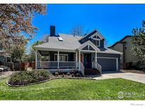 Charming two-story home with a covered porch and well-maintained landscaping at 5978 Scotswood Ct, Boulder, CO 80301