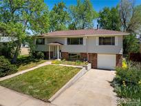 Charming split-level home with a manicured lawn and inviting curb appeal, a great Gathering residence at 1270 Berea Dr, Boulder, CO 80305