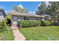 Charming home with a landscaped front yard and welcoming entrance at 200 Perry St, Denver, CO 80219