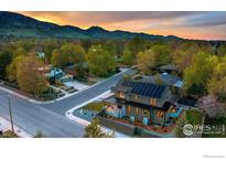 Stunning two-story home with solar panels, manicured lawn and sunset views in a suburban neighborhood at 2700 15Th St, Boulder, CO 80304