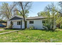 Charming single-story home featuring a manicured lawn and inviting curb appeal in a quiet neighborhood at 3100 Denton Ave, Boulder, CO 80303
