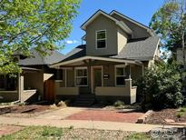 Charming home with a covered front porch, brick walkway, and inviting curb appeal at 3440 W 33Rd Ave, Denver, CO 80211