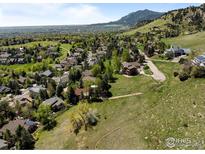 Breathtaking aerial view showcasing the lush community with mountain views and well-maintained homes at 3945 Promontory Ct, Boulder, CO 80304