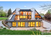 Stunning contemporary home featuring a spacious deck and walls of windows providing ample natural light at 630 Northstar Ct, Boulder, CO 80304