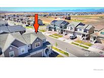 Desirable townhome featuring a modern design and an inviting color scheme within a well-maintained neighborhood at 700 Lillibrook Pl, Erie, CO 80026